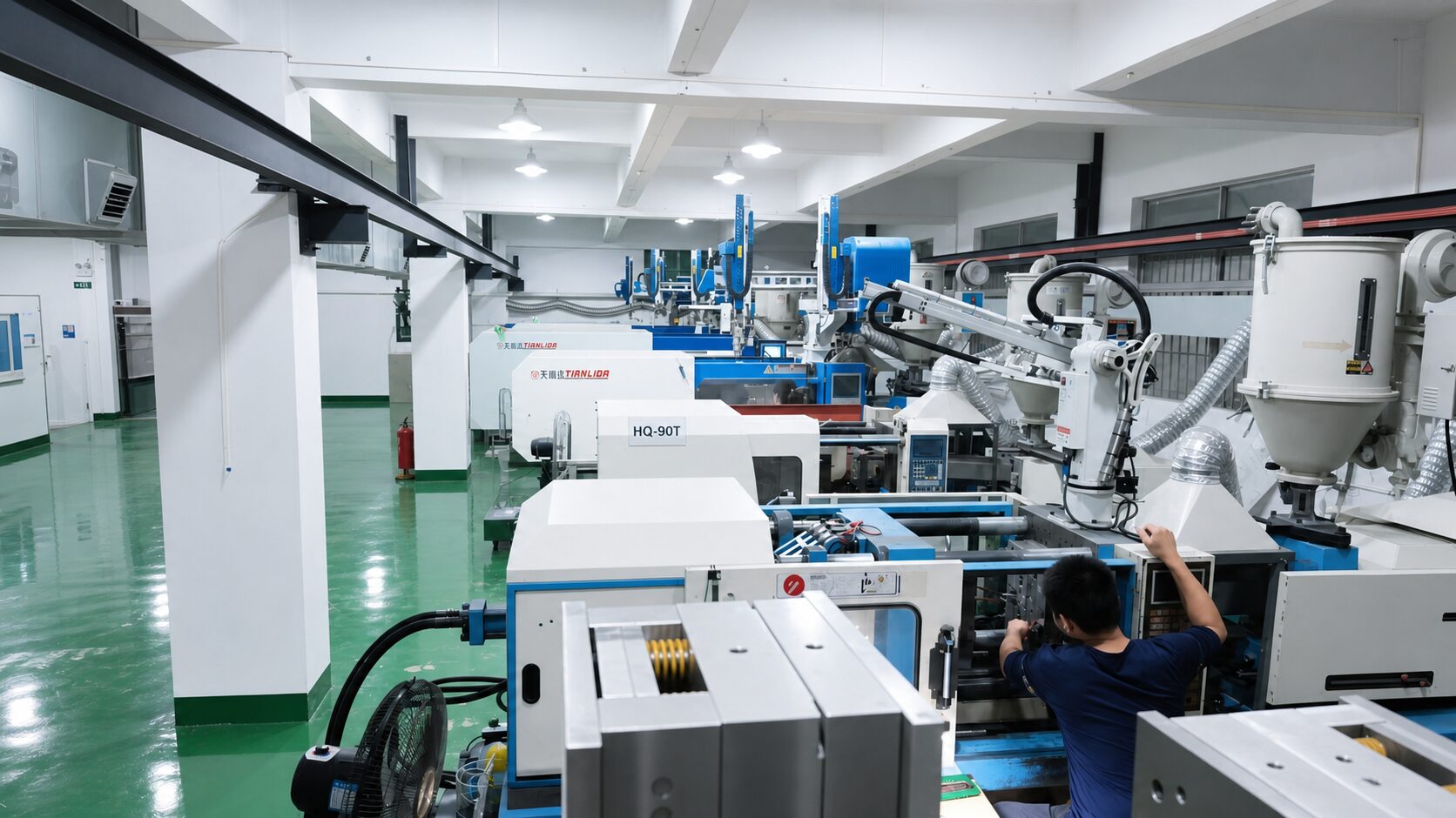 Injection molding machines running trial shots
